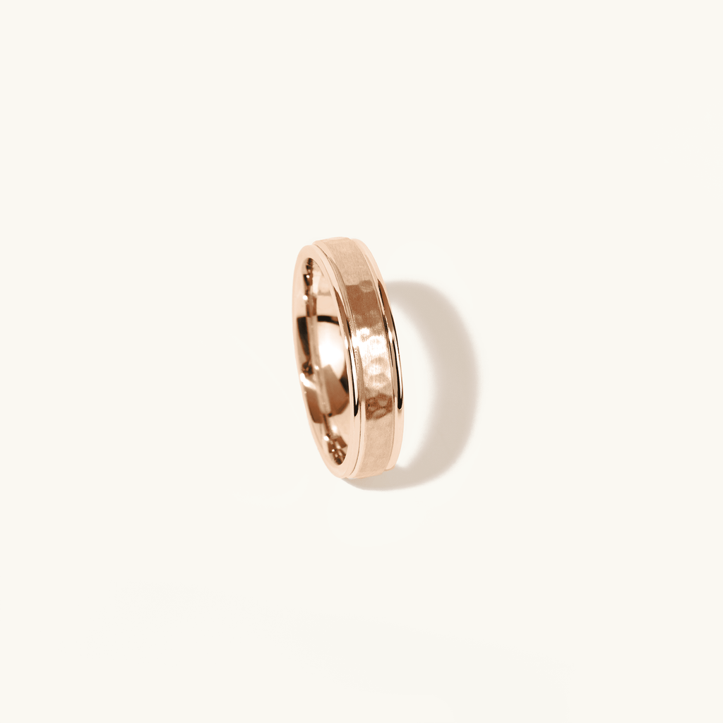 Profile view of Jewellers District's Hammered Wedding Ring in 14k Rose Gold