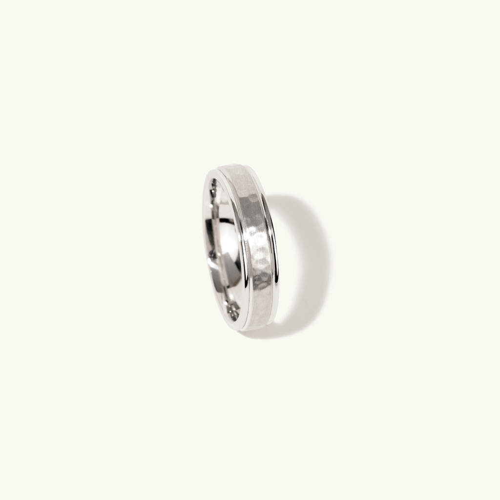 Profile view of Jewellers District's Hammered Wedding Ring in 14k White Gold