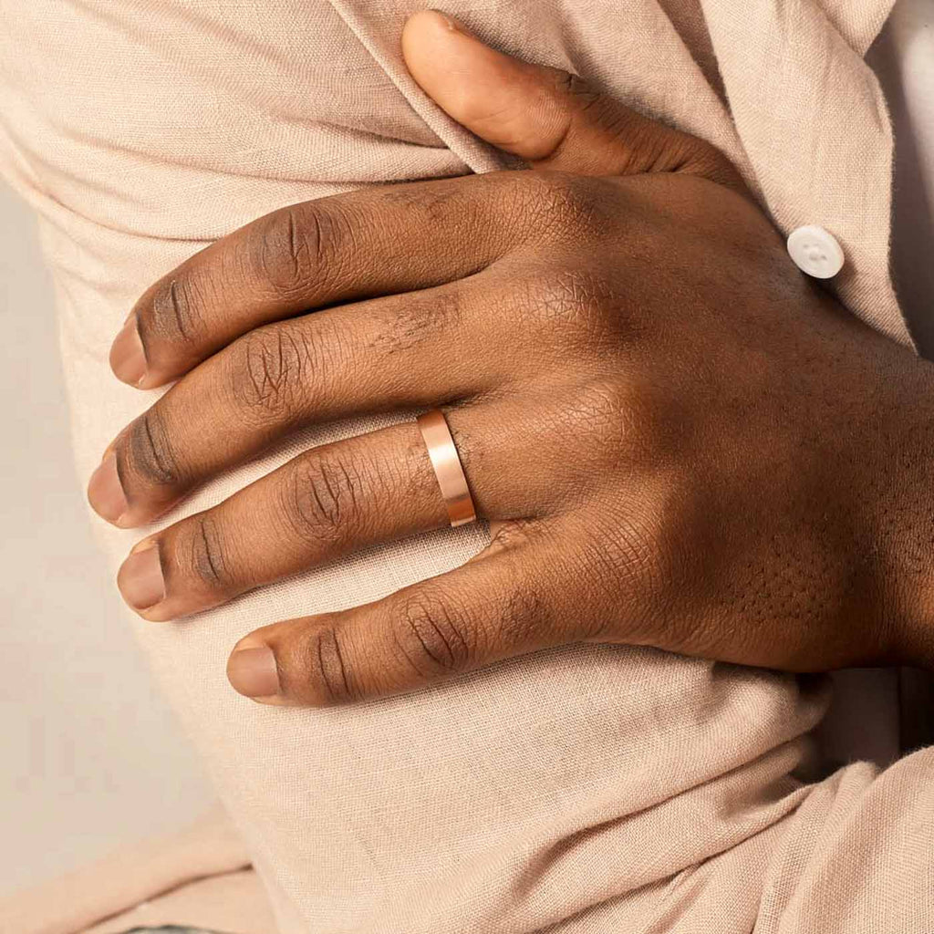 Model wearing Jewellers District's Flat Brushed Wedding Ring in 14k Rose Gold, Band: 5mm #4