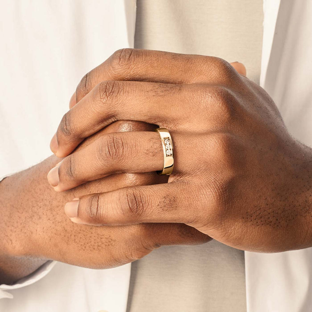 Model wearing Jewellers District's Flat Wedding Ring with Accent Diamonds in 14k Yellow Gold