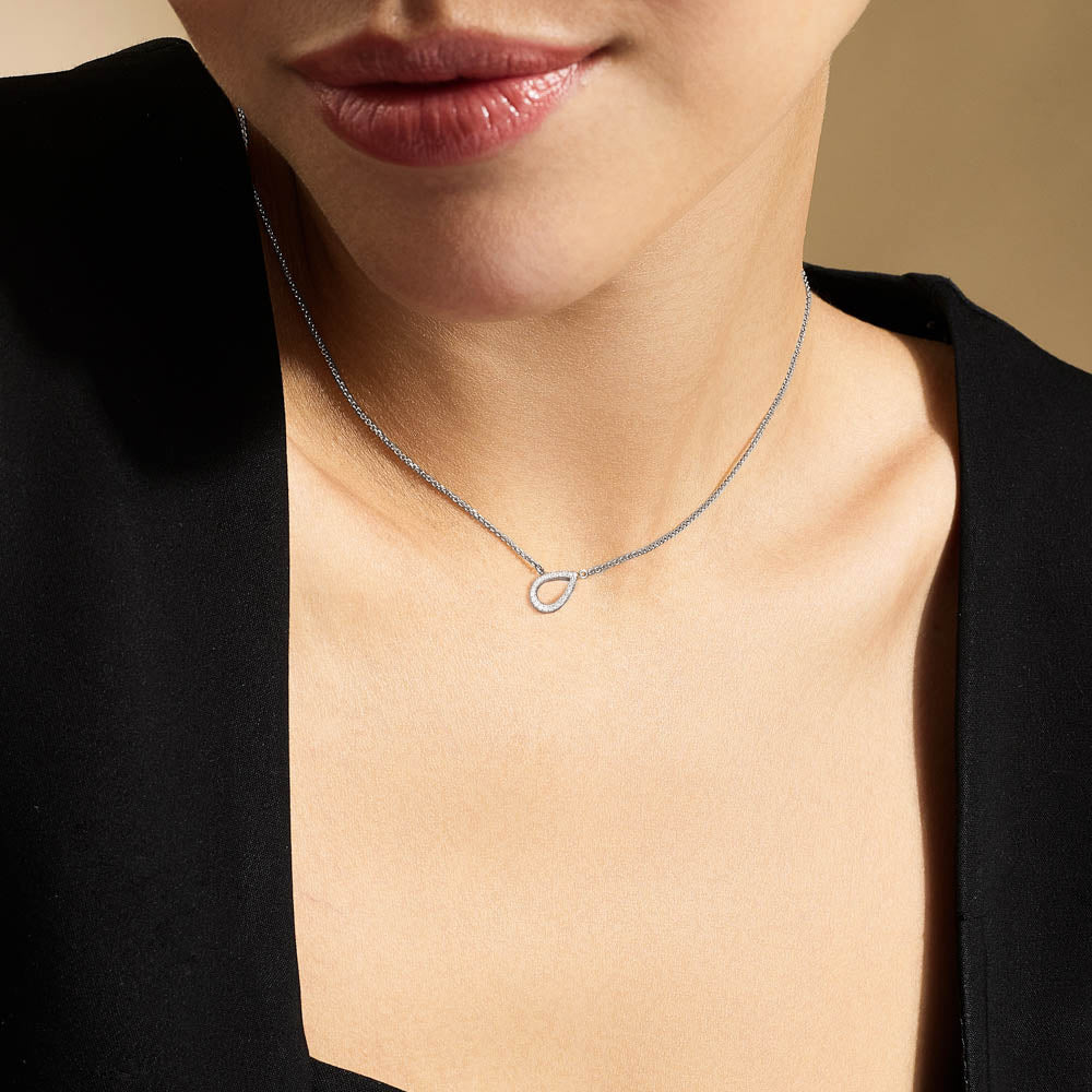 Model wearing Jewellers District's Pear Diamond Pavé Pendant Necklace in 10k White Gold #4