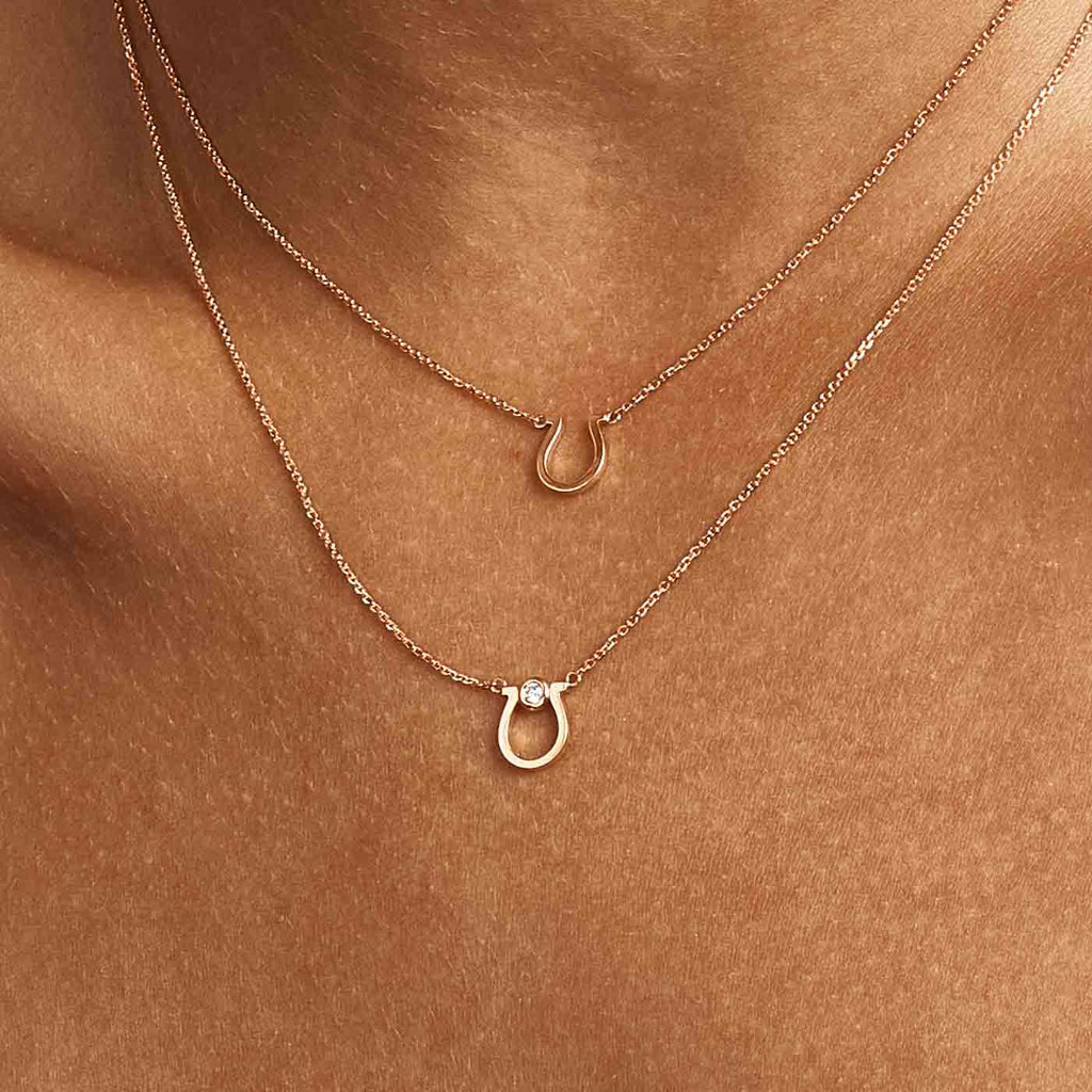 Model wearing Jewellers District's Gold Horseshoe Pendant Necklace in 14k Rose Gold #4