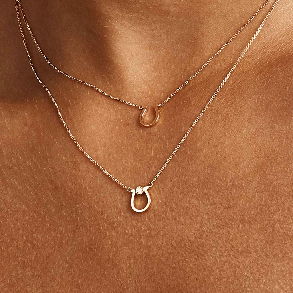 Model wearing Jewellers District's Gold Horseshoe Pendant Necklace in 14k Rose Gold #3