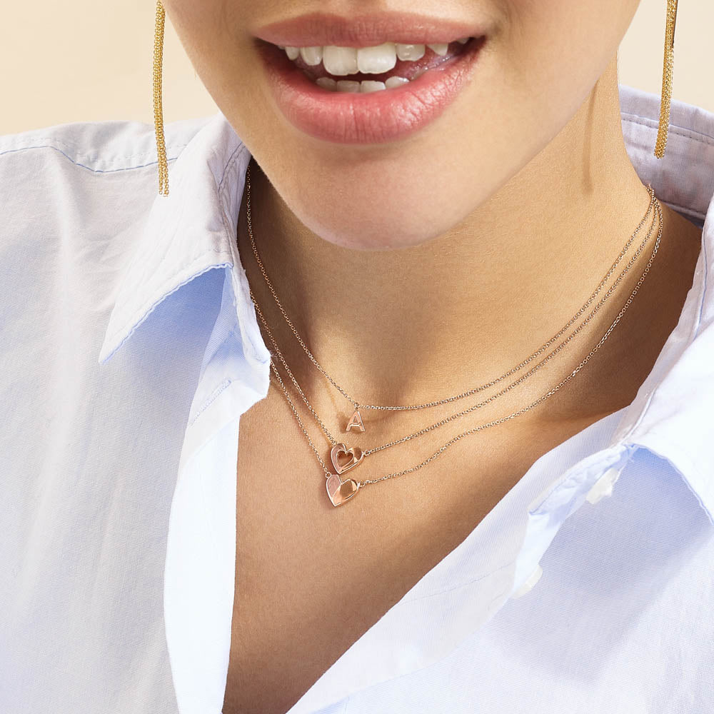 Model wearing Jewellers District's Gold Initial Pendant Necklace: A in 14k Rose Gold #3