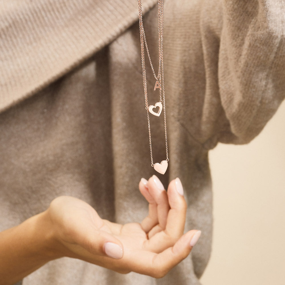 Model wearing Jewellers District's Gold Initial Pendant Necklace: A in 14k Rose Gold