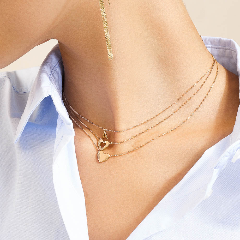 Model wearing Jewellers District's Gold Initial Pendant Necklace: A in 14k Yellow Gold #2