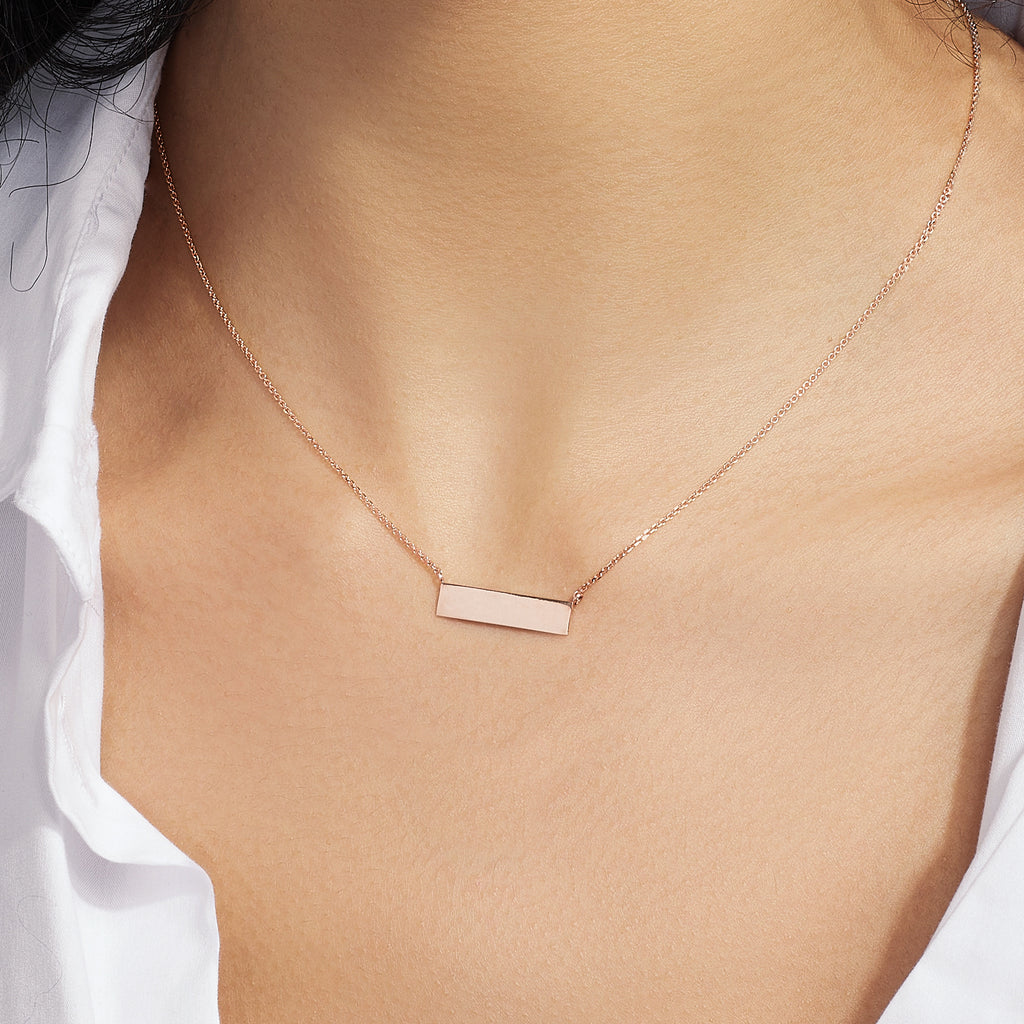 Model wearing Jewellers District's Gold Bar Pendant Necklace in 14k Rose Gold