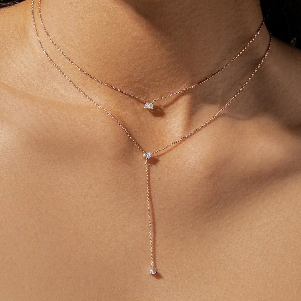 Model wearing Jewellers District's Emerald Cut Diamond Pendant Necklace in 10k Rose Gold