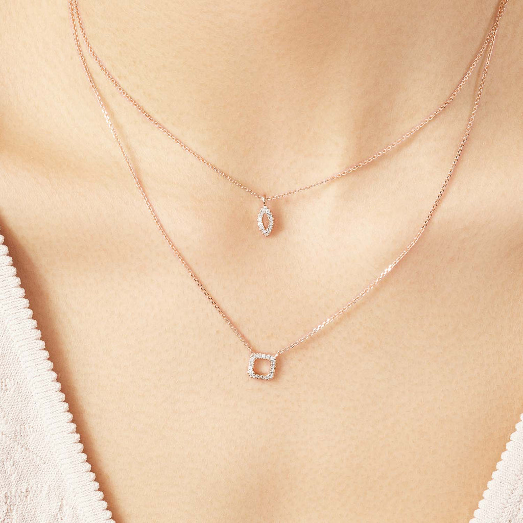 Model wearing Jewellers District's Square Diamond Pavé Pendant Necklace in 10k Rose Gold #4