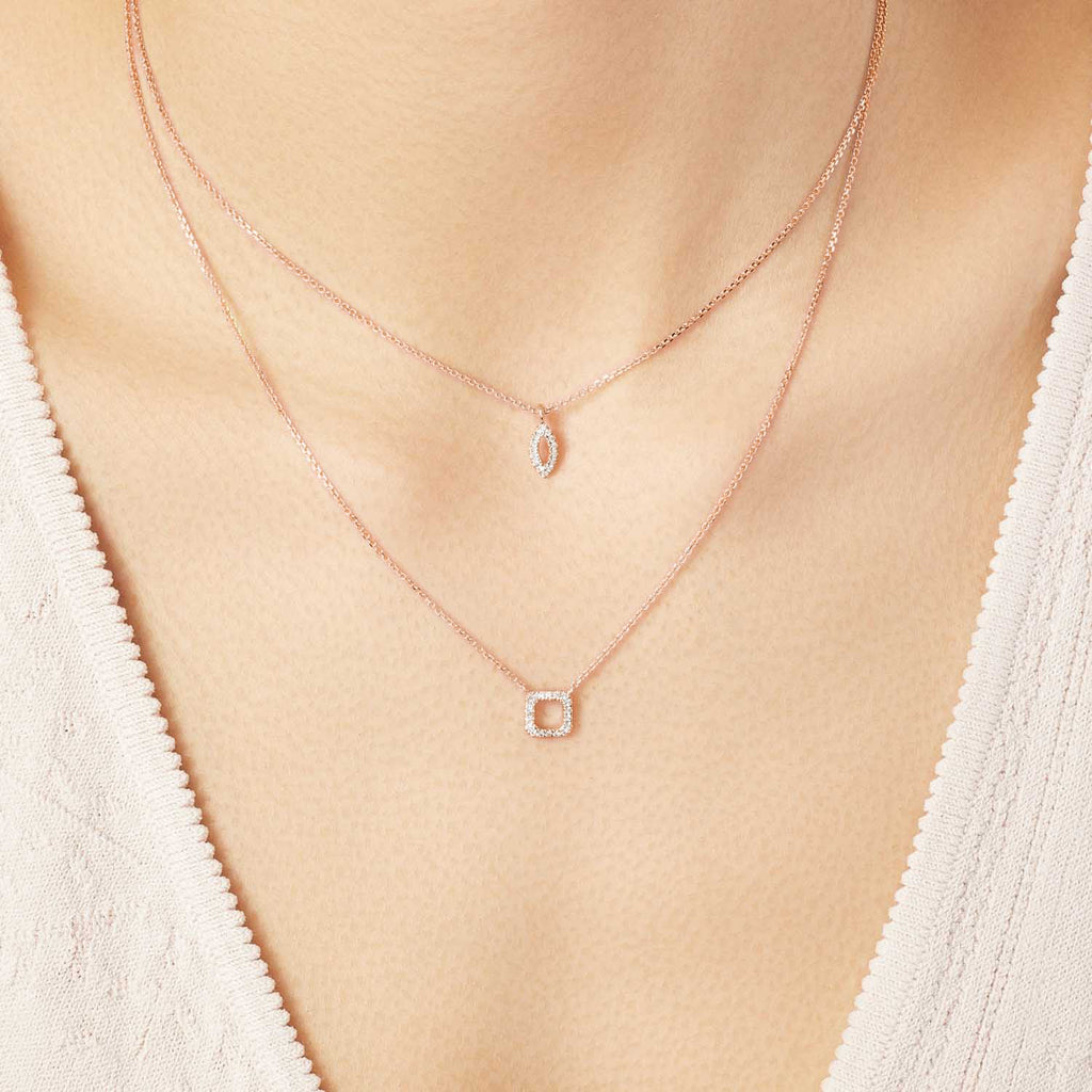 Model wearing Jewellers District's Square Diamond Pavé Pendant Necklace in 10k Rose Gold #2