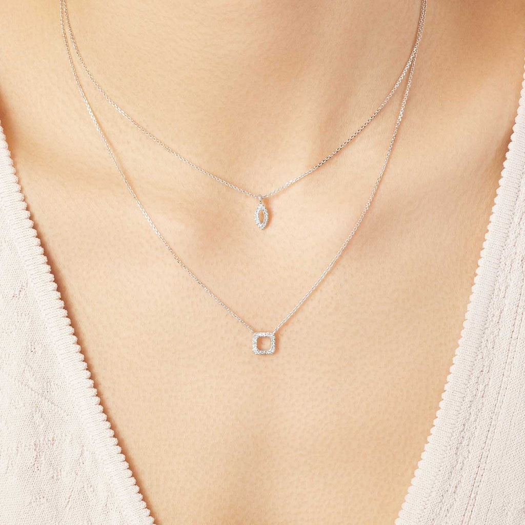 Model wearing Jewellers District's Square Diamond Pavé Pendant Necklace in 10k White Gold #4