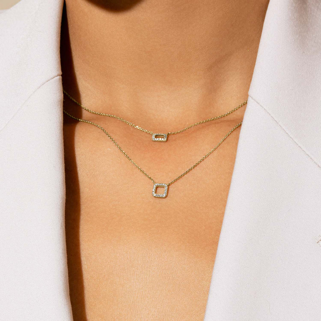 Model wearing Jewellers District's Square Diamond Pavé Pendant Necklace in 10k Yellow Gold