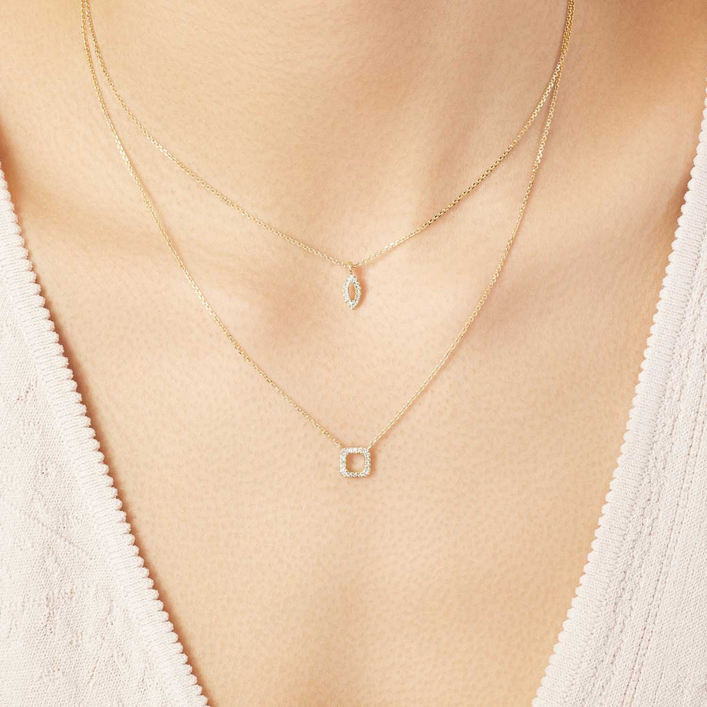 Model wearing Jewellers District's Square Diamond Pavé Pendant Necklace in 10k Yellow Gold #2