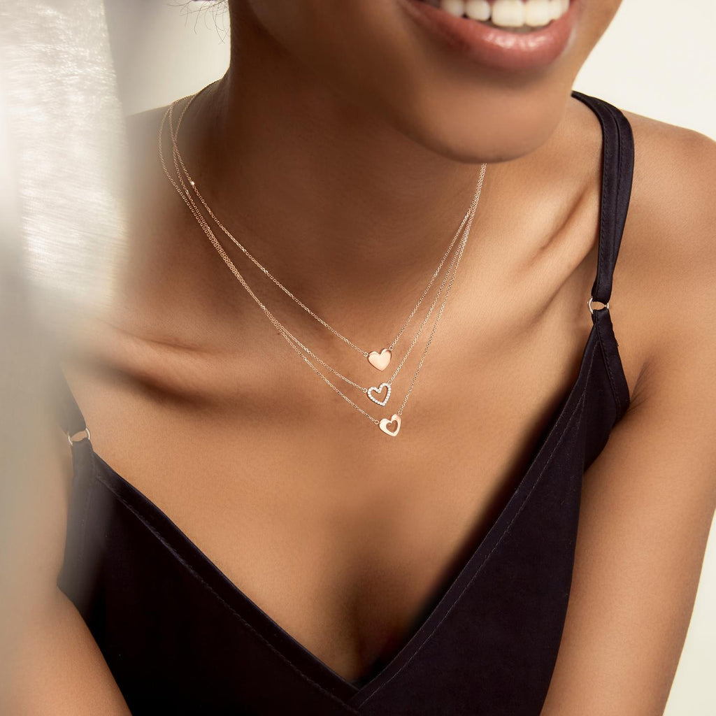 Model wearing Jewellers District's Gold Heart Pendant Necklace in 14k Rose Gold #4