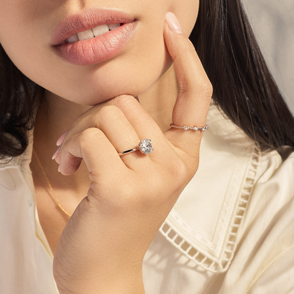 Model wearing Jewellers District's Two-Prong Diamond Wedding Ring in 14k Rose Gold #2