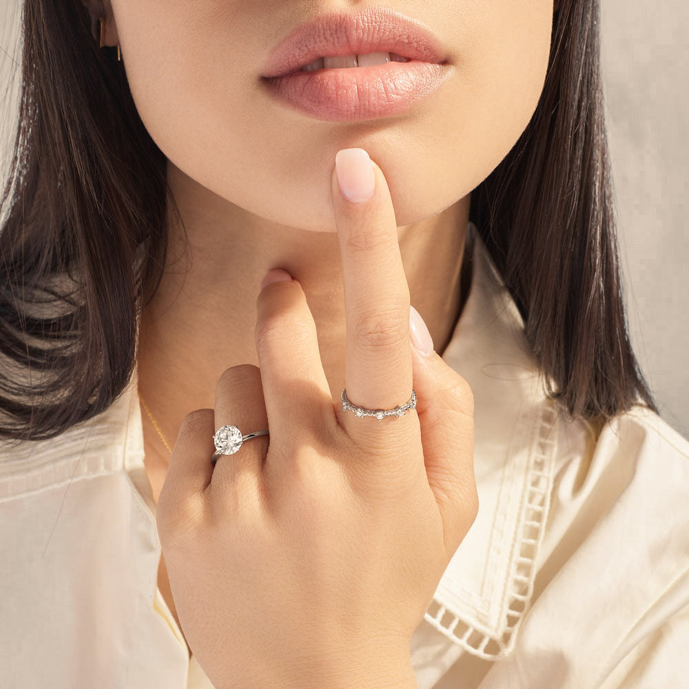 Model wearing Jewellers District's Two-Prong Diamond Wedding Ring in 14k White Gold