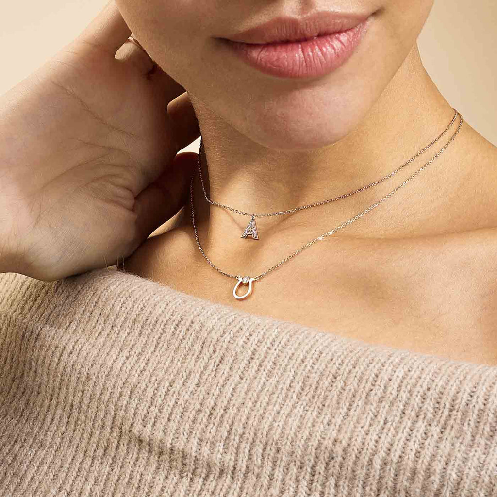 Model wearing Jewellers District's Horseshoe Pendant Necklace with Accent Diamond in 14k Rose Gold #4