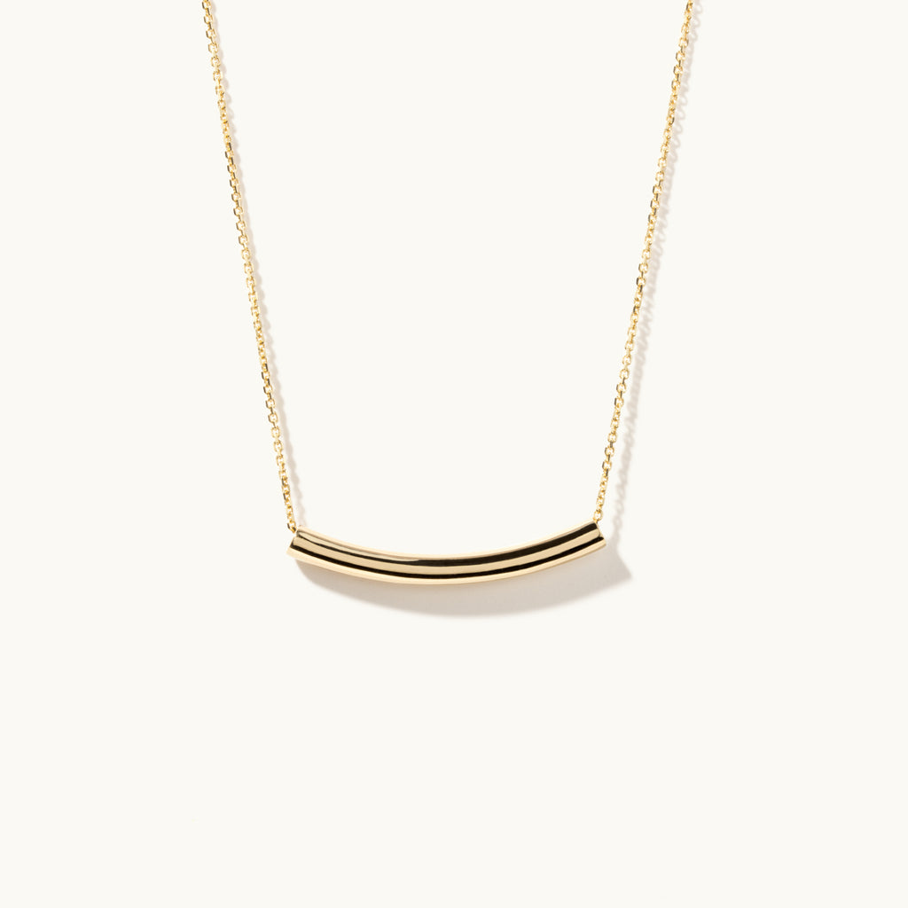 Face view of Jewellers District's Arc of Life Curved Gold Necklace in 10k Yellow Gold