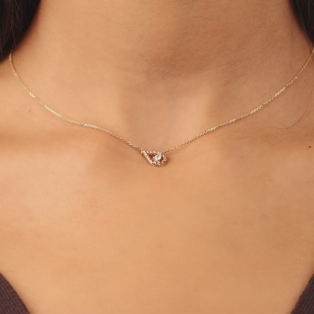 Video showcasing Jewellers District's Twist Pear Necklace with Accent Diamond in 14k Rose Gold